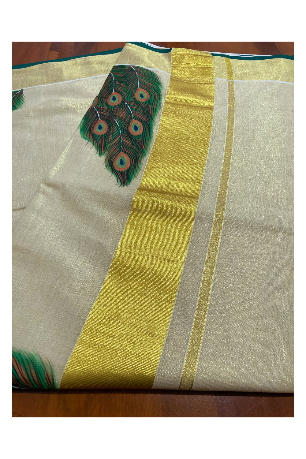 Kerala Tissue Kasavu Saree with Hand Painted Feather Design and Dark Green on Border