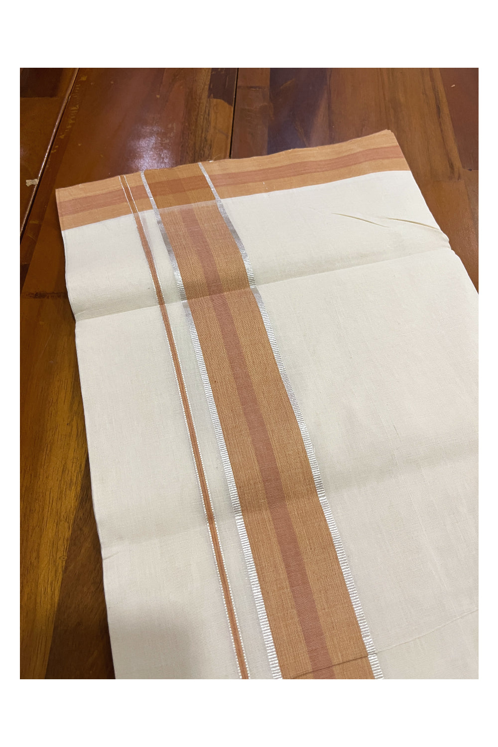 Southloom Premium Unakkupaavu Handloom Mundu with Silver Kasavu and Orange Border (South Indian Dhoti)