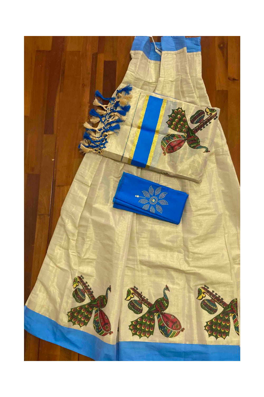 Kerala Tissue Stitched Dhavani Set with Blouse Piece and Neriyathu in with Light Blue Accents and Mural Designs