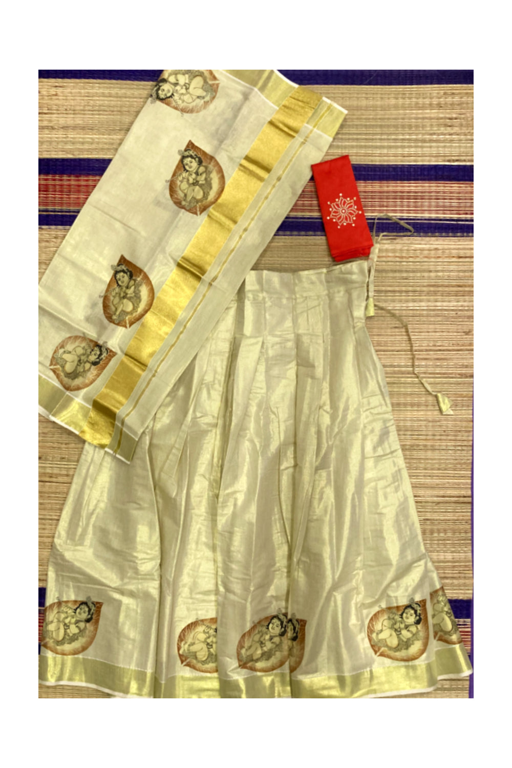 Kerala Tissue Semi Stitched Dhavani Set with Baby Krishna Mural Printed Design and Orange Blouse Piece