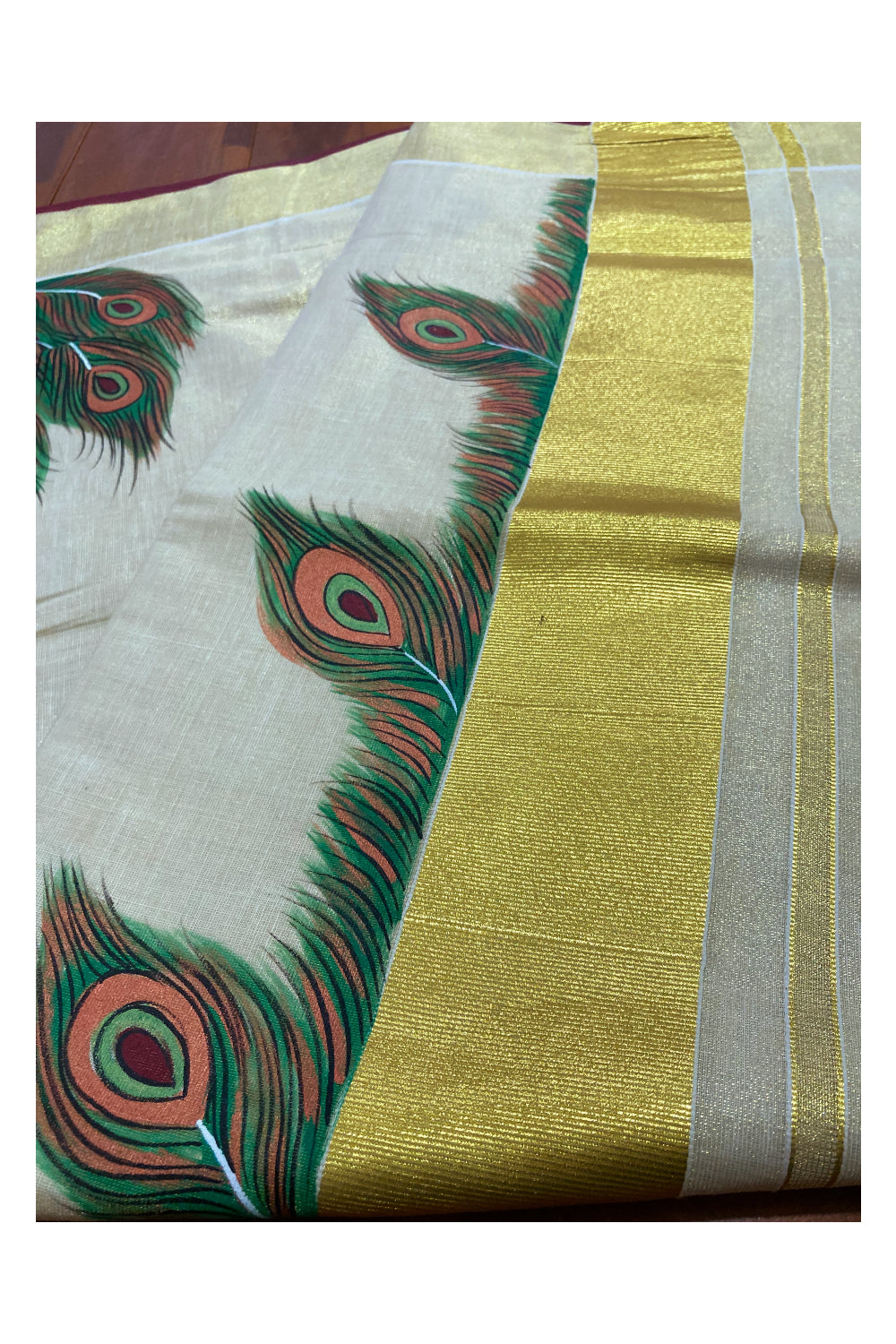Kerala Tissue Kasavu Saree with Hand Painted Feather Design and Maroon on Border