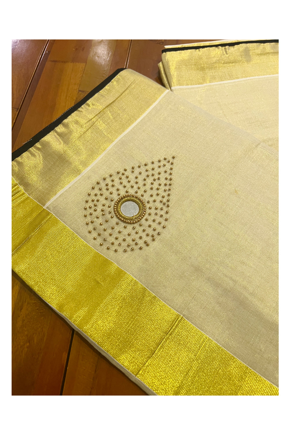 Kerala Tissue Kasavu Saree with Bead and Mirrorwork Design and Black Piping Works on Border