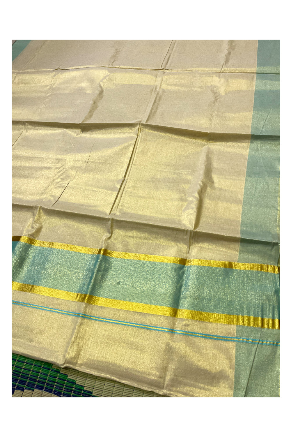 Kerala Tissue Kasavu Plain Saree with Turquoise and Kasavu Border