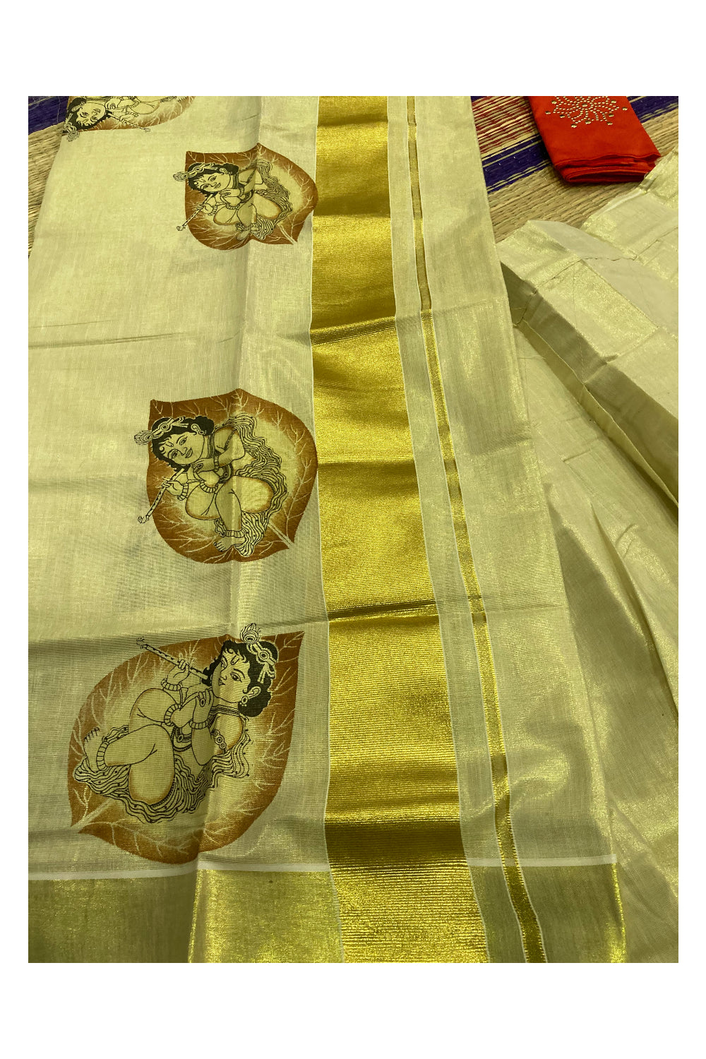 Kerala Tissue Semi Stitched Dhavani Set with Baby Krishna Mural Printed Design and Orange Blouse Piece