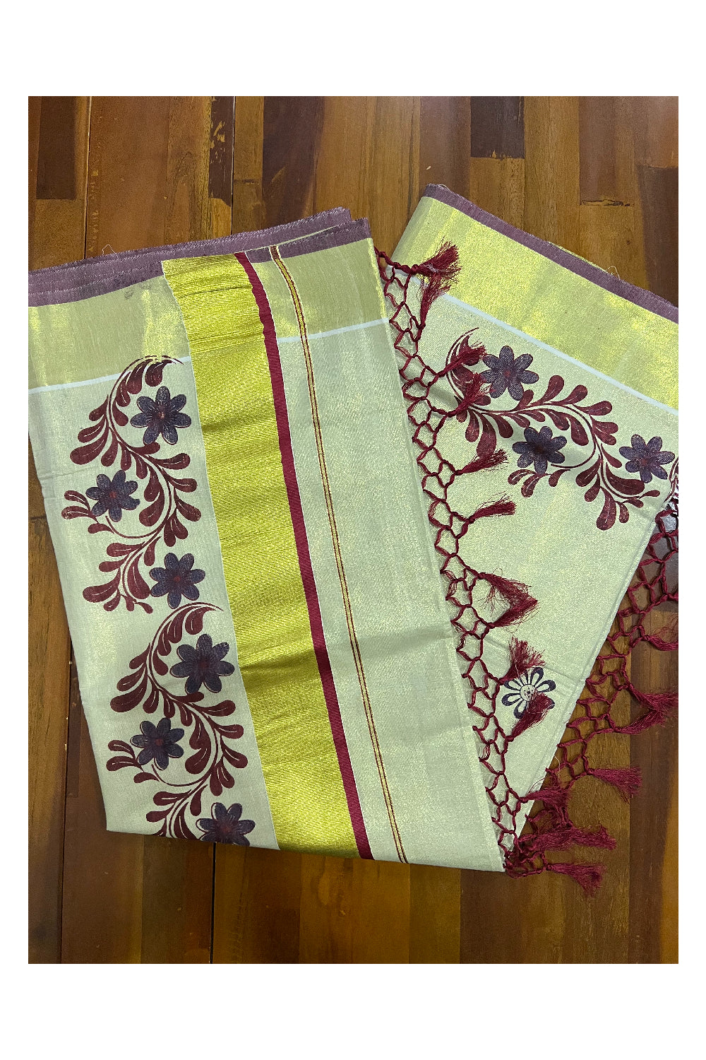 Kerala Tissue Kasavu Saree with Maroon Violet Mural Floral Design and Tassels on Pallu