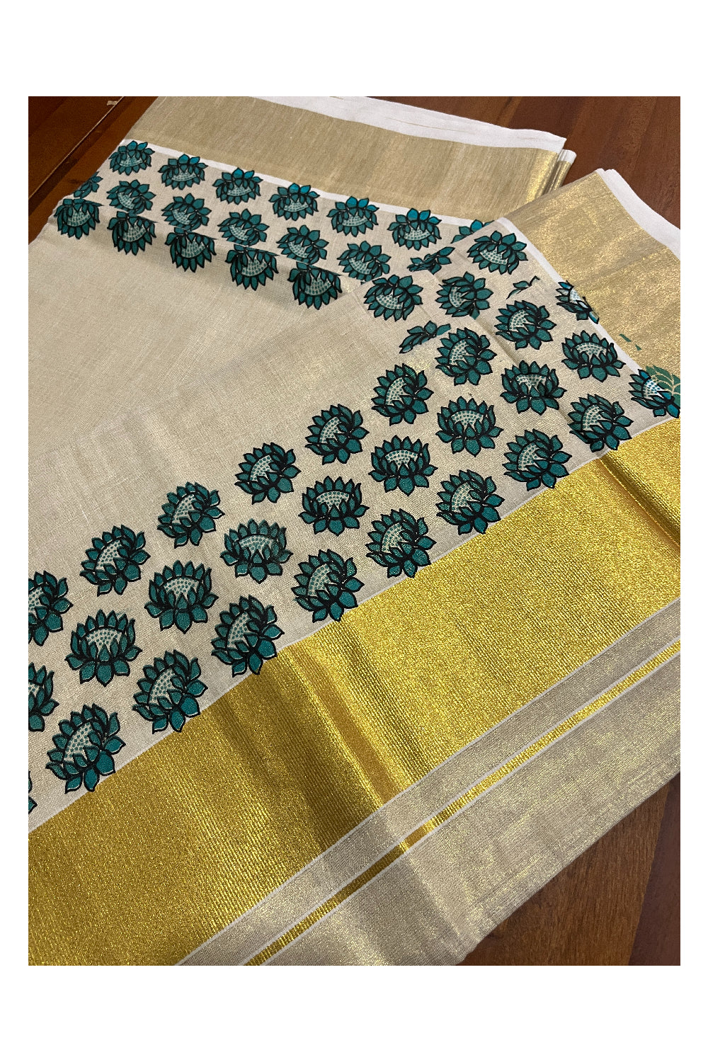 Kerala Tissue Kasavu Saree with Blue Floral Block Printed Design