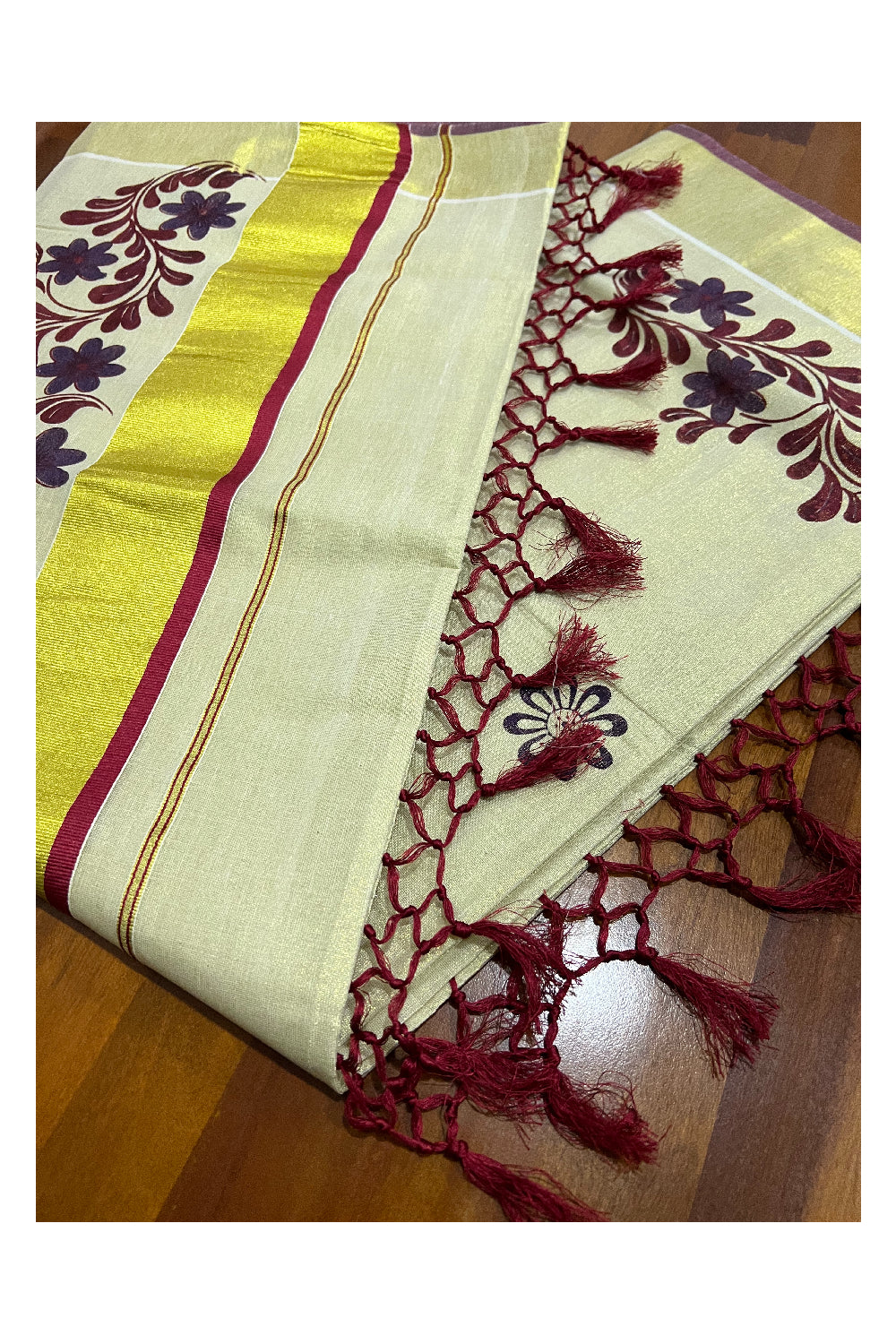 Kerala Tissue Kasavu Saree with Maroon Violet Mural Floral Design and Tassels on Pallu