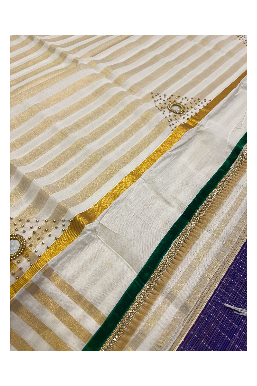 Kerala Tissue Kasavu Lines Saree with Bead and Mirrorwork Design and Green Piping Works on Border