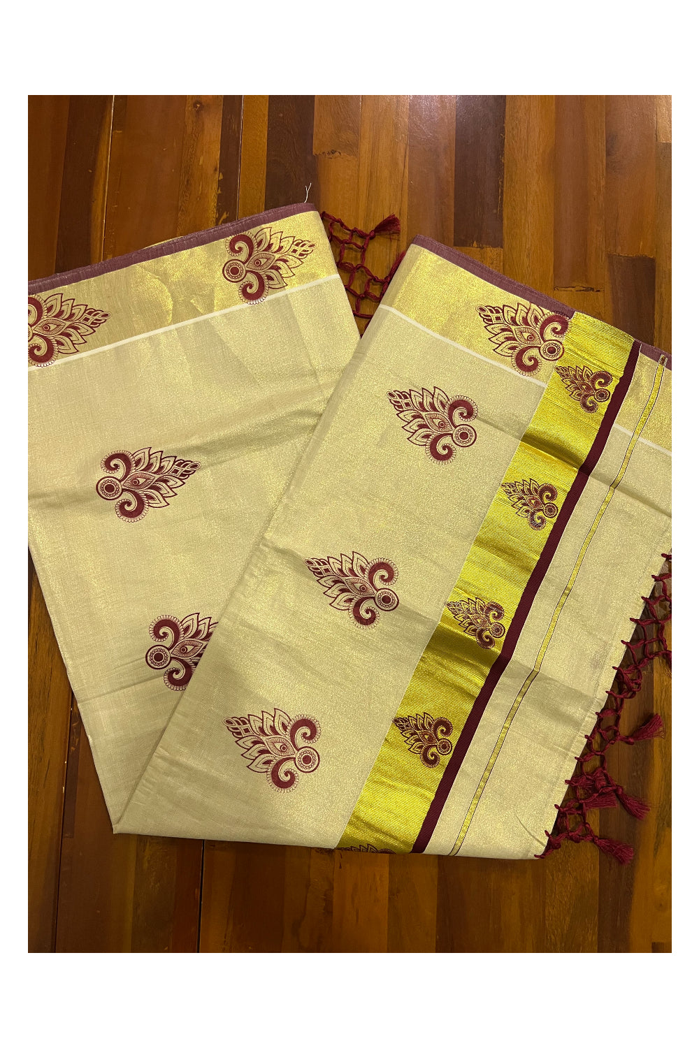 Kerala Tissue Kasavu Saree with Maroon Block Printed Design and Tassels Work on Pallu