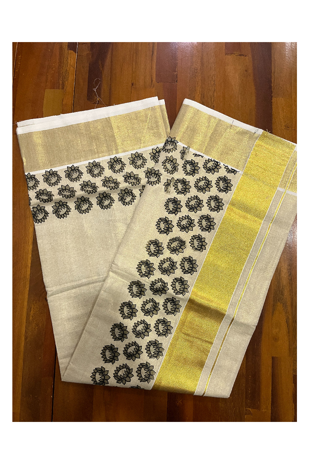 Kerala Tissue Kasavu Saree with Black Floral Block Printed Design