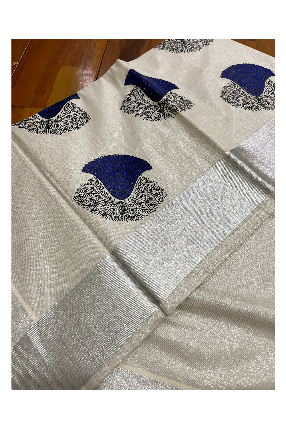 Kerala Silver Tissue Kasavu Saree with Dark Blue Floral Embroidery Design
