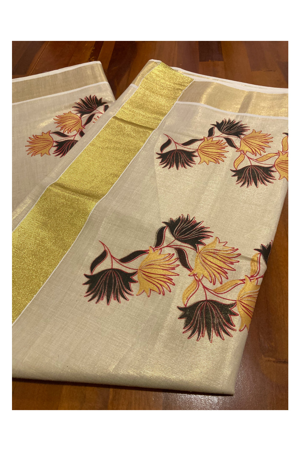 Kerala Tissue Kasavu Saree With Mural Printed Black and Yellow Floral Design