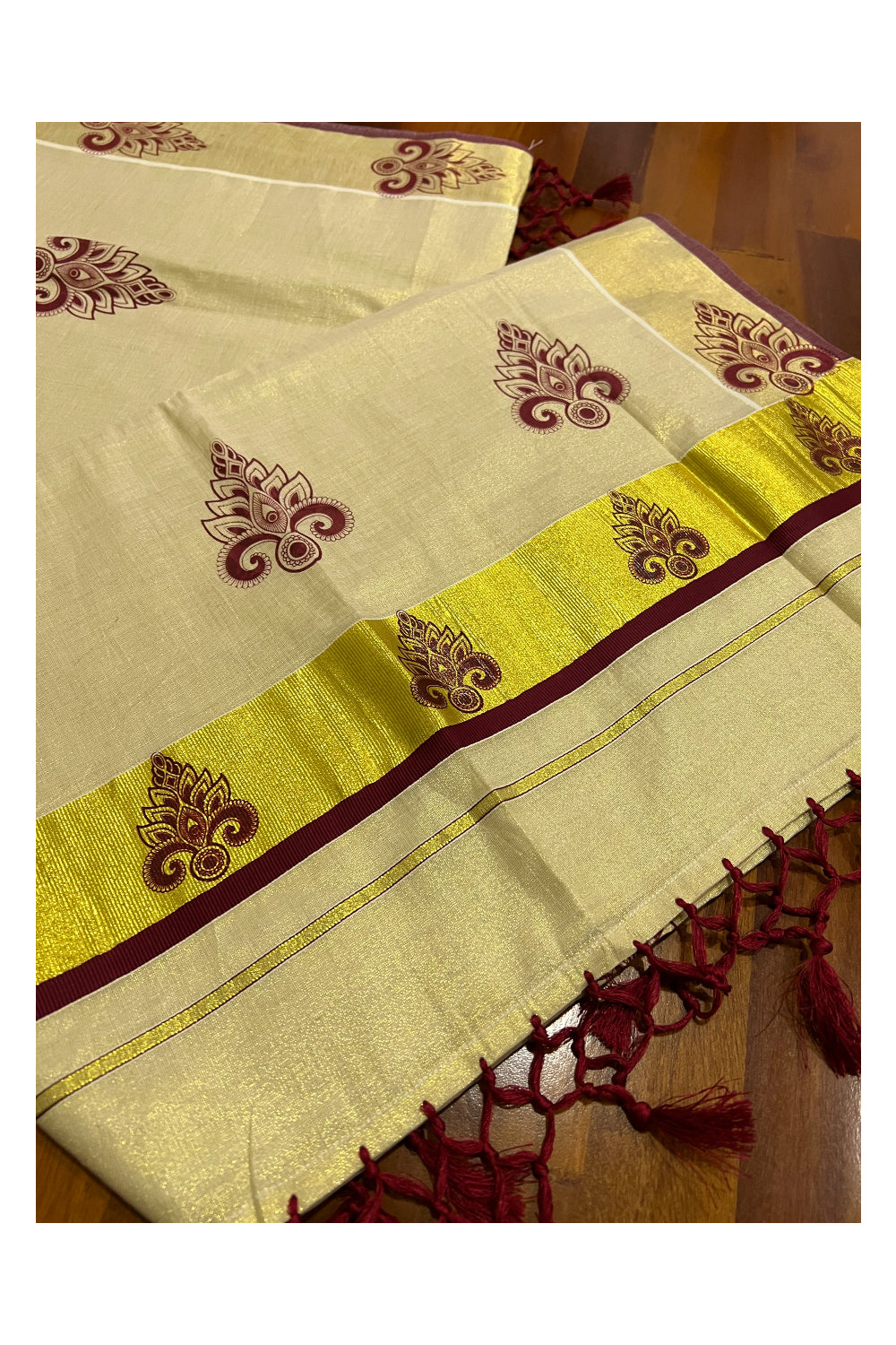 Kerala Tissue Kasavu Saree with Maroon Block Printed Design and Tassels Work on Pallu