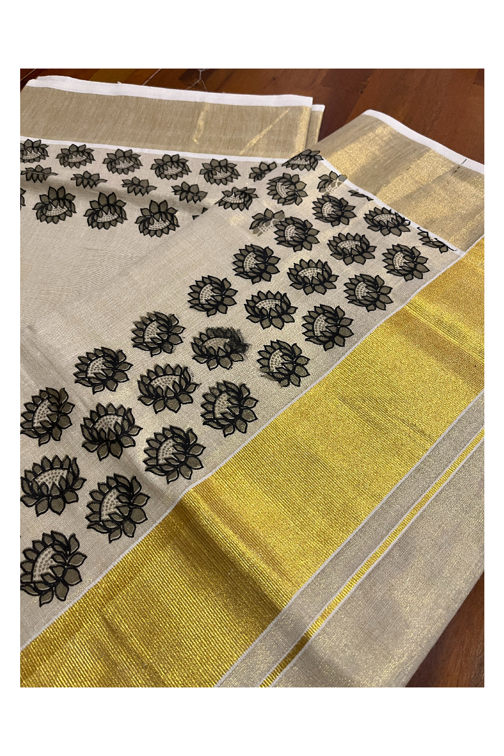 Kerala Tissue Kasavu Saree with Black Floral Block Printed Design