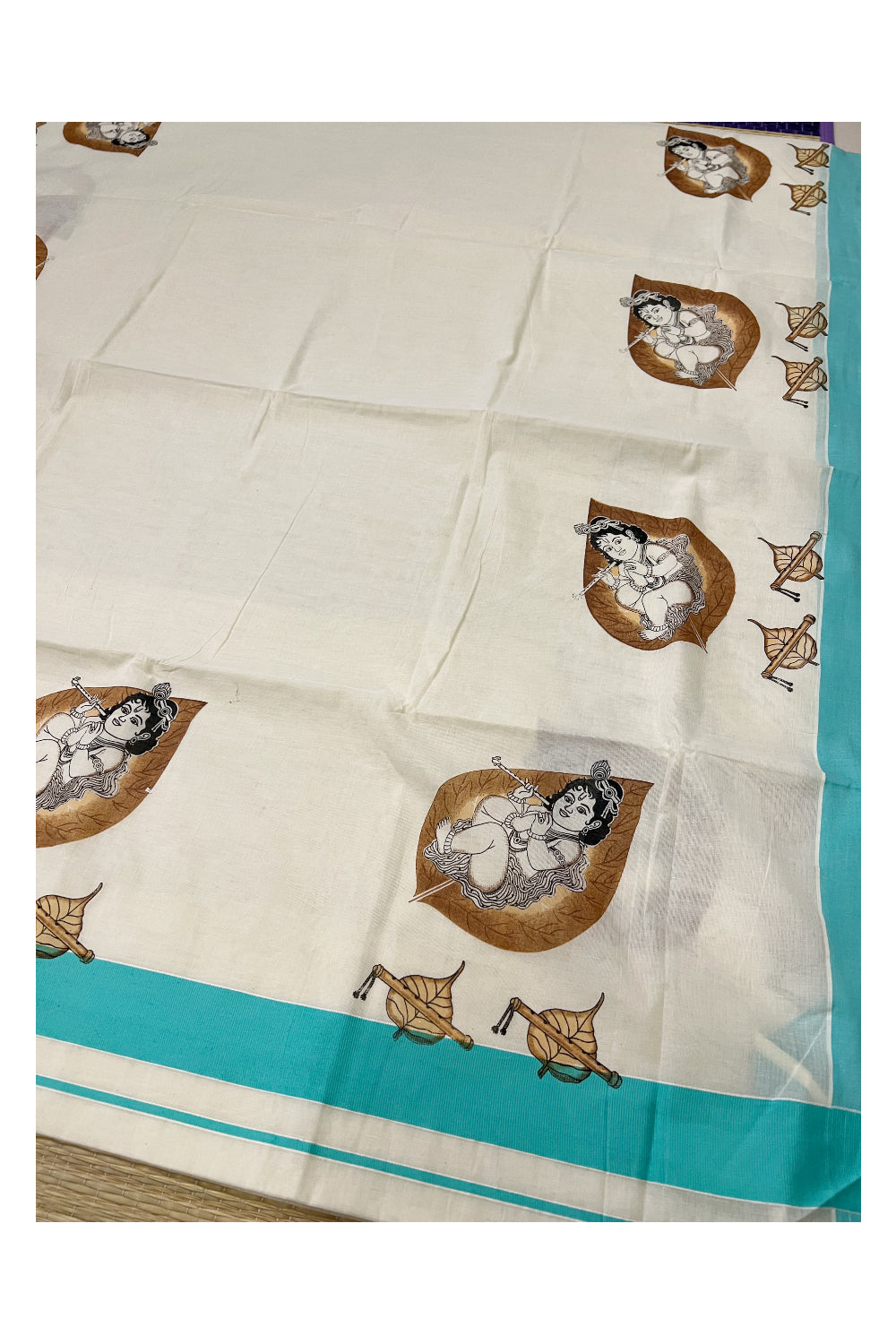 Kerala Pure Cotton Saree with Mural Printed Baby Krishna on Leaf Design and Turquoise Border