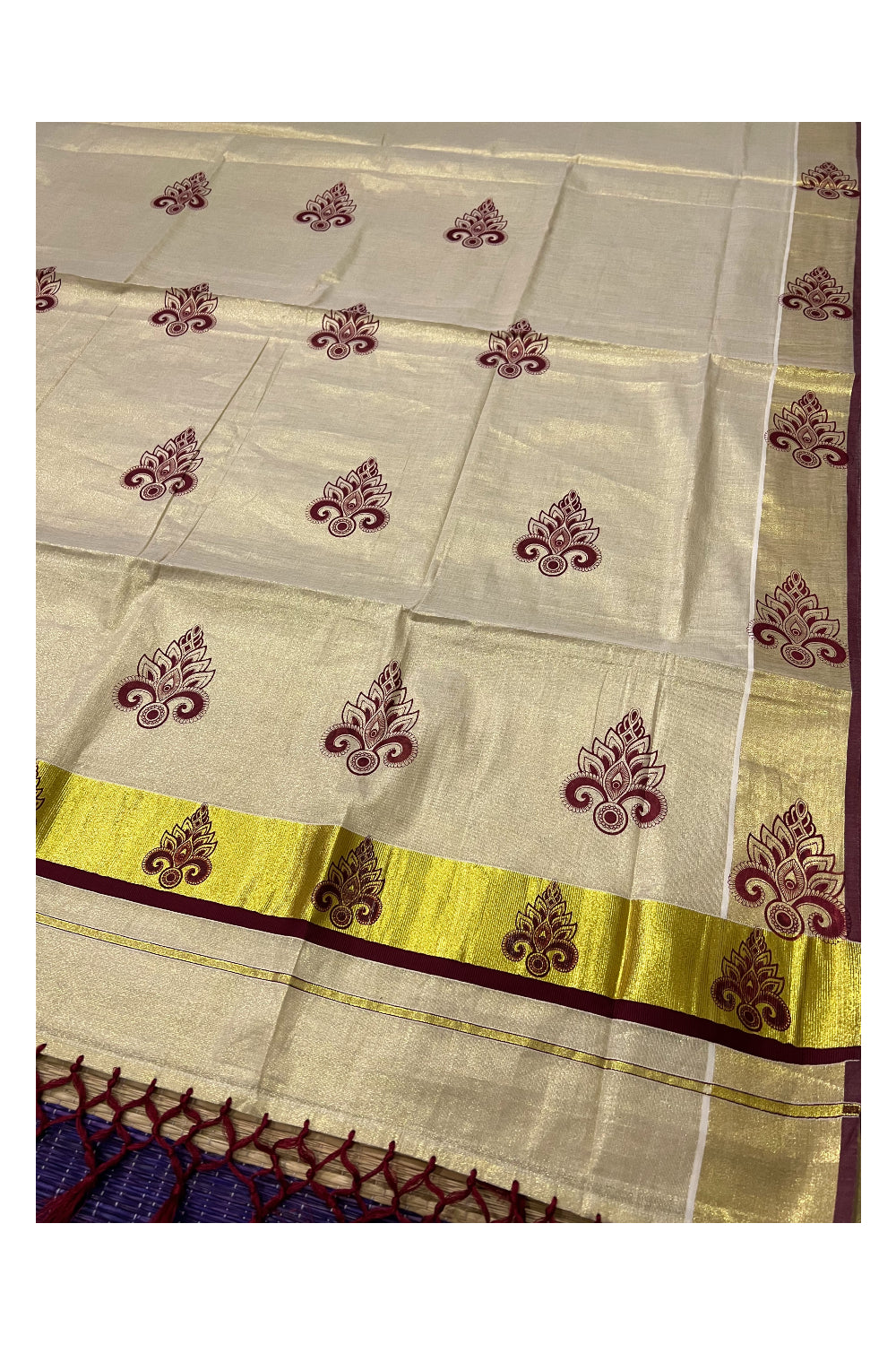 Kerala Tissue Kasavu Saree with Maroon Block Printed Design and Tassels Work on Pallu