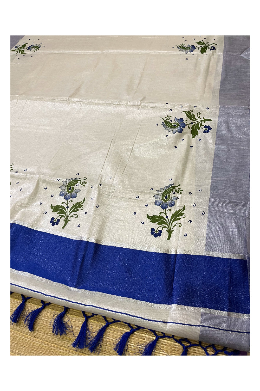 Kerala Tissue Kasavu Saree with Blue Green Mural Floral Design and Tassels on Pallu