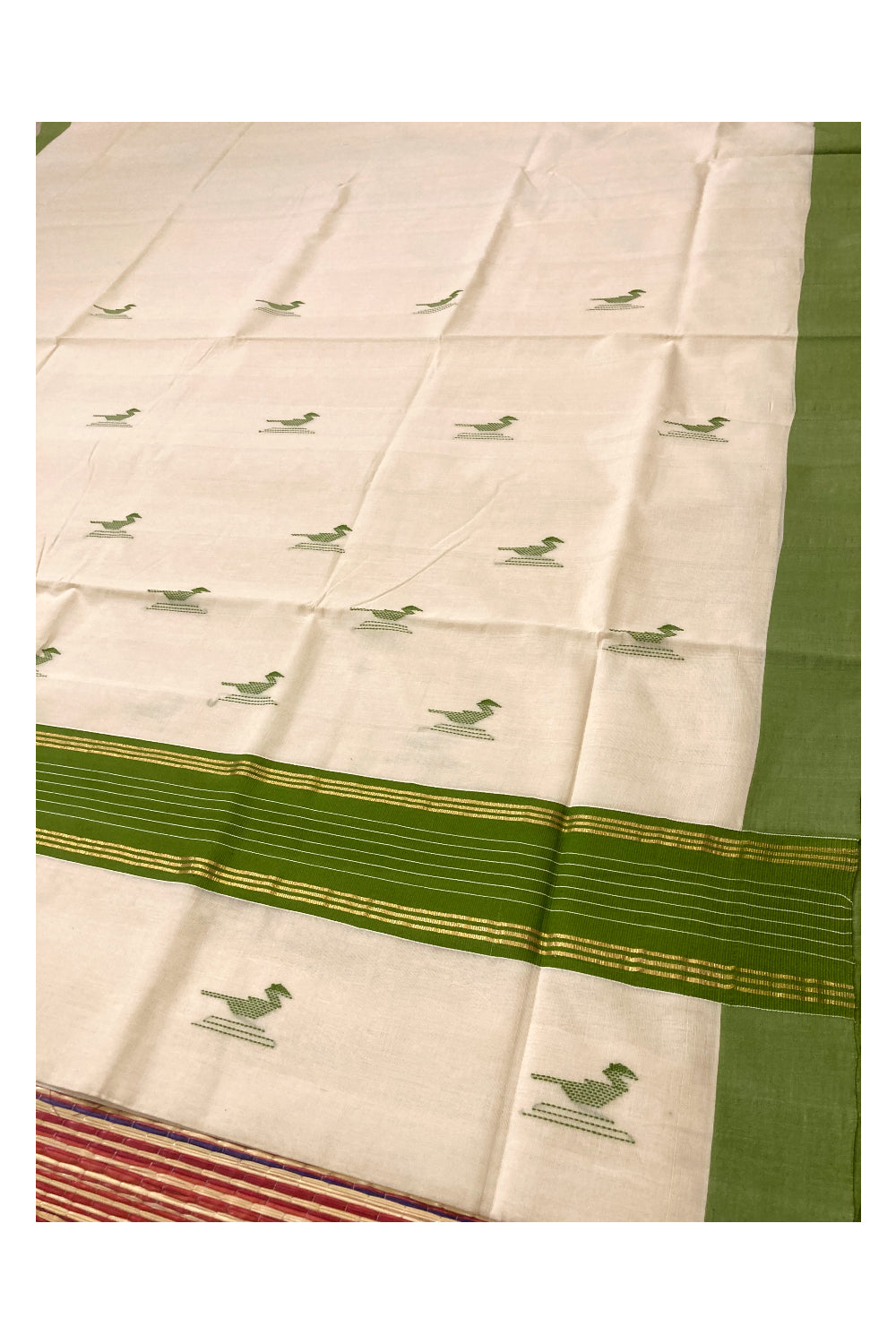 Southloom Premium Unakkupaavu Handloom Kerala Saree with Green and Pure Kasavu Border and Butta Works on Body