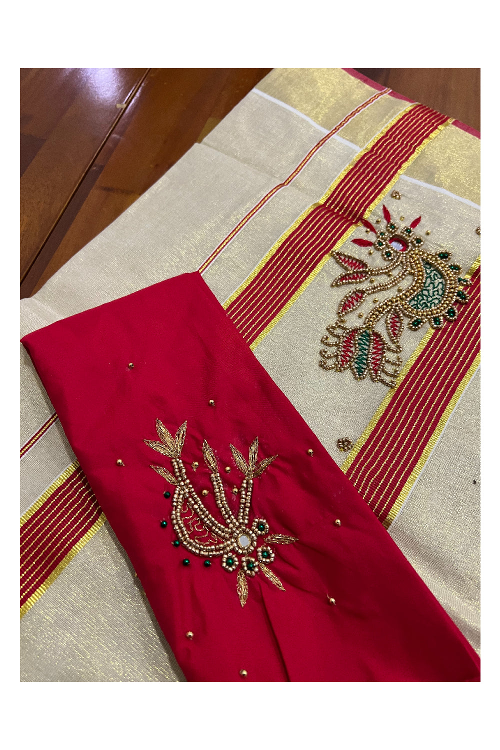 Kerala Tissue Kasavu Saree with Floral Themed Bead Work Design and Red Blouse Piece