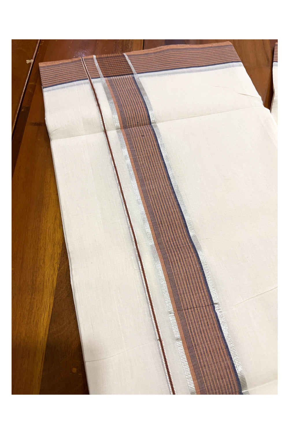 Southloom Premium Unakkupaavu Handloom Mundu with Silver Kasavu and Orange Border (South Indian Kerala Dhoti)