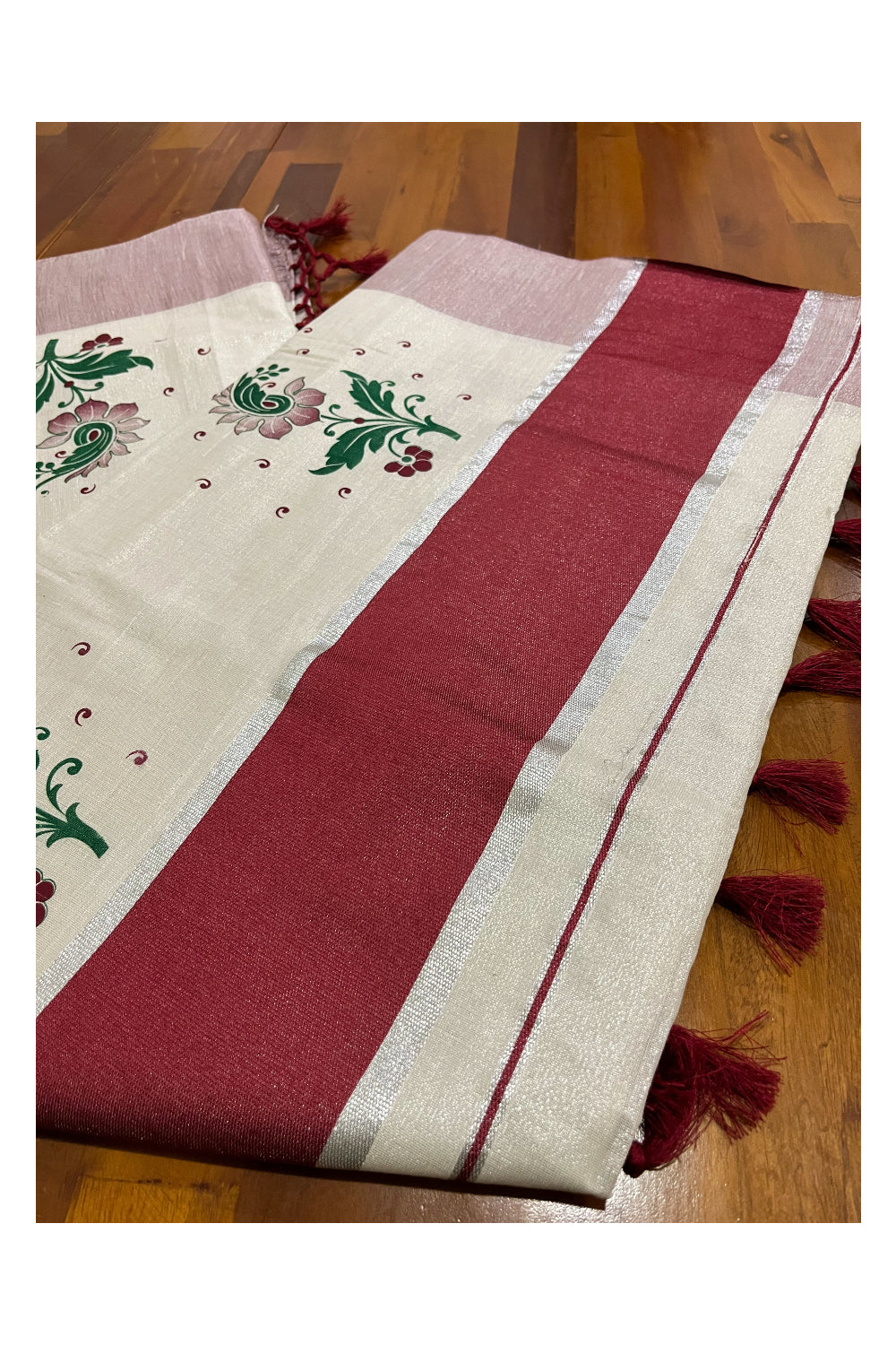 Kerala Tissue Kasavu Saree with Maroon Green Mural Floral Design and Tassels on Pallu