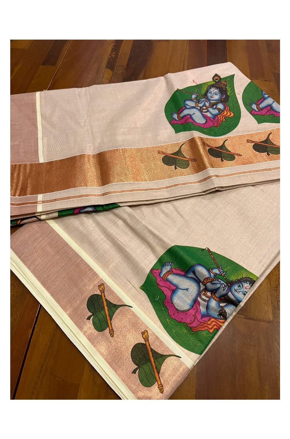 Kerala Copper Tissue Kasavu Saree With Mural Printed Baby Krishna Design and Leaf Prints on Border