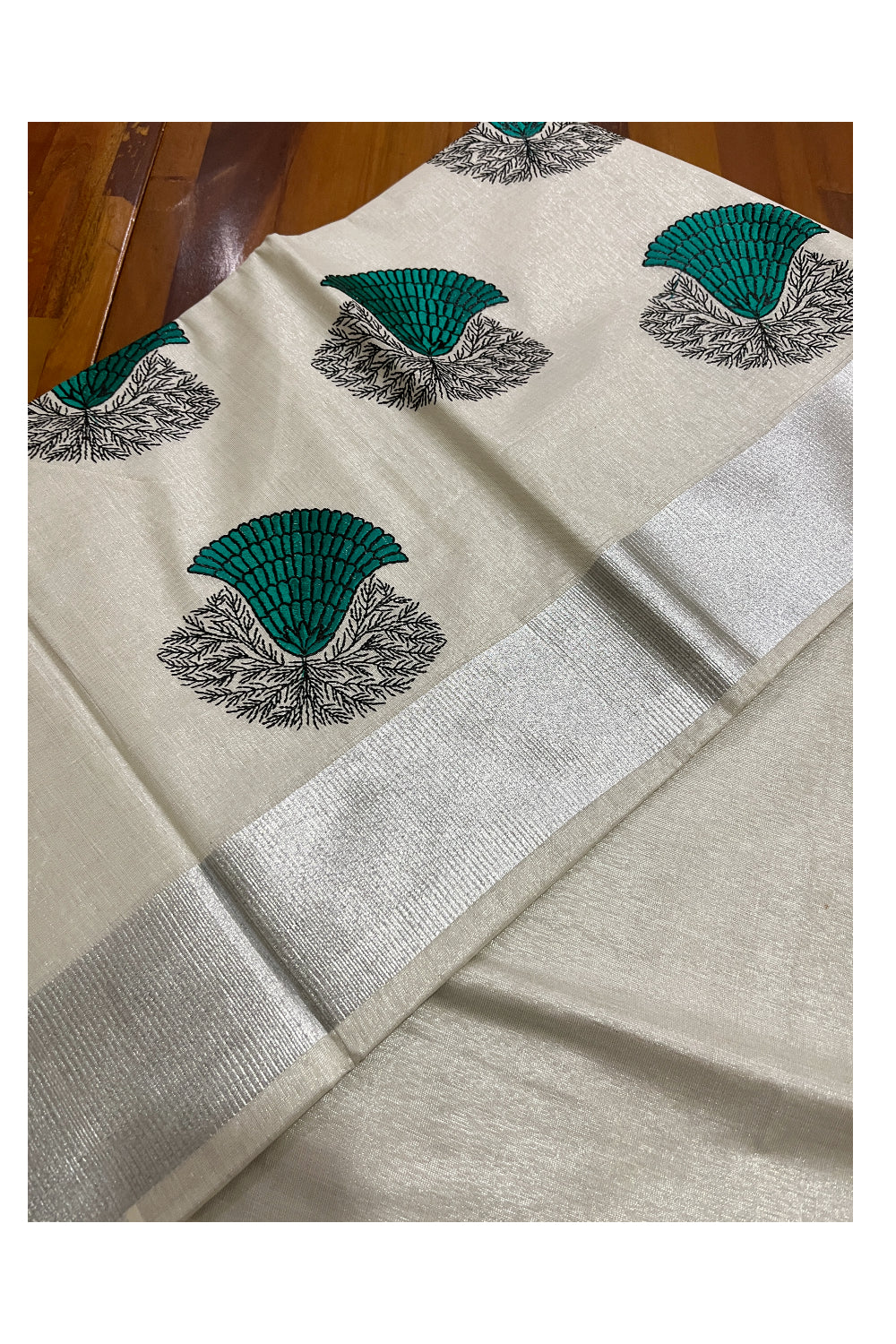 Kerala Silver Tissue Kasavu Saree with Green Floral Embroidery Design