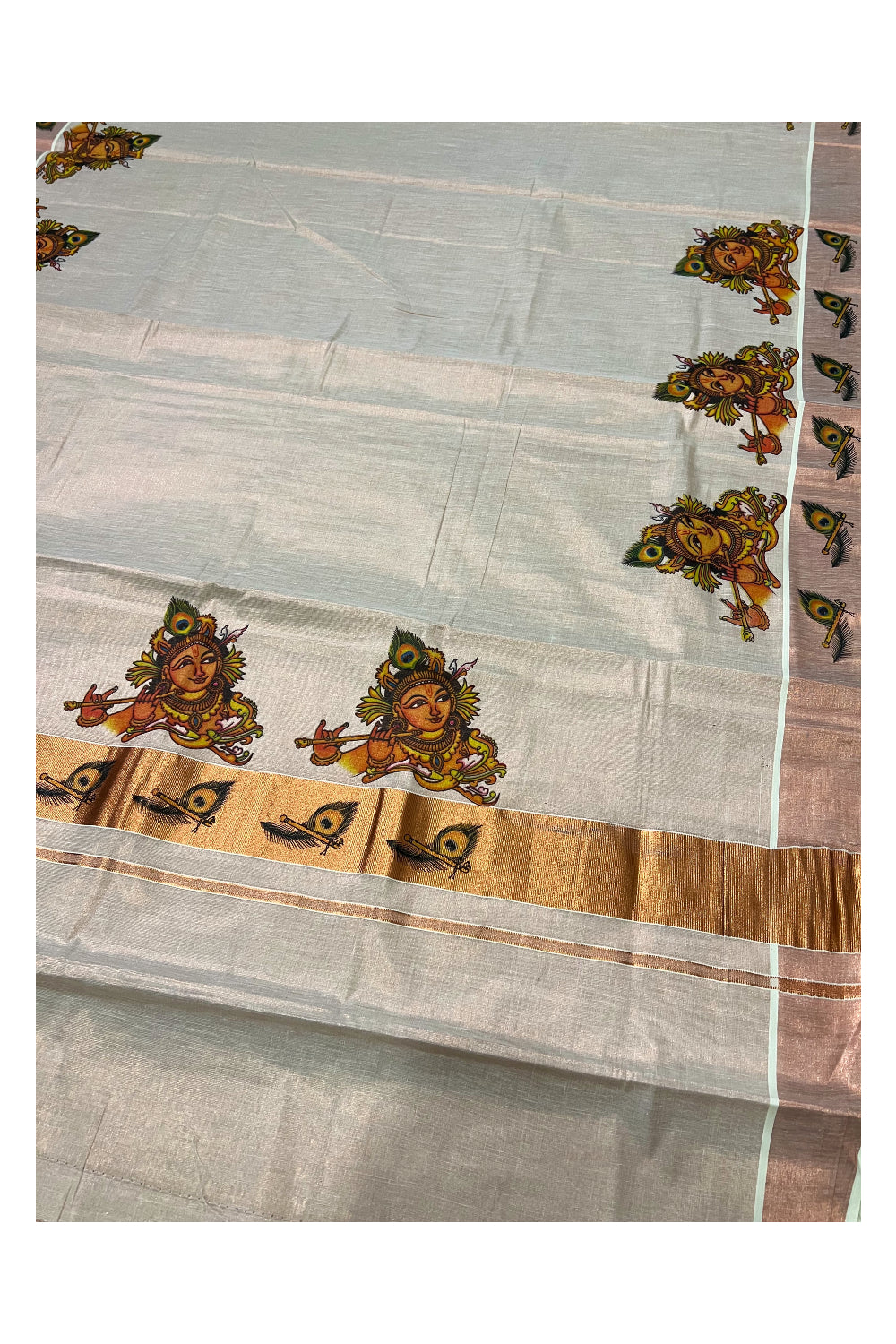 Kerala Copper Tissue Kasavu Saree With Mural Printed Krishna Face Design and Feather Prints on Border