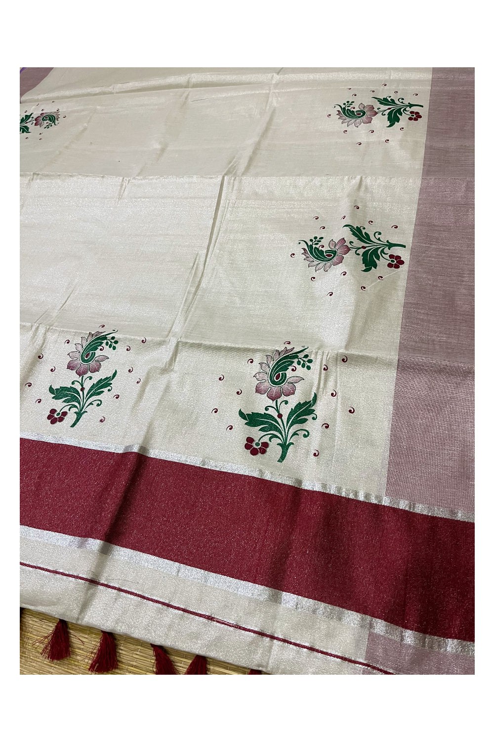 Kerala Tissue Kasavu Saree with Maroon Green Mural Floral Design and Tassels on Pallu