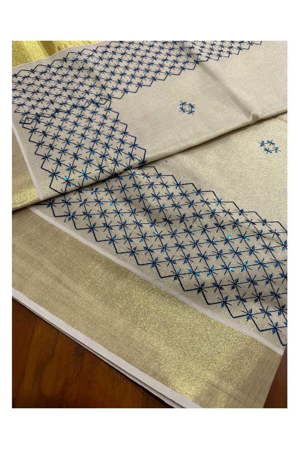 Kerala Tissue Kasavu Sequins Heavy Work Saree with Blue Thread Work Design