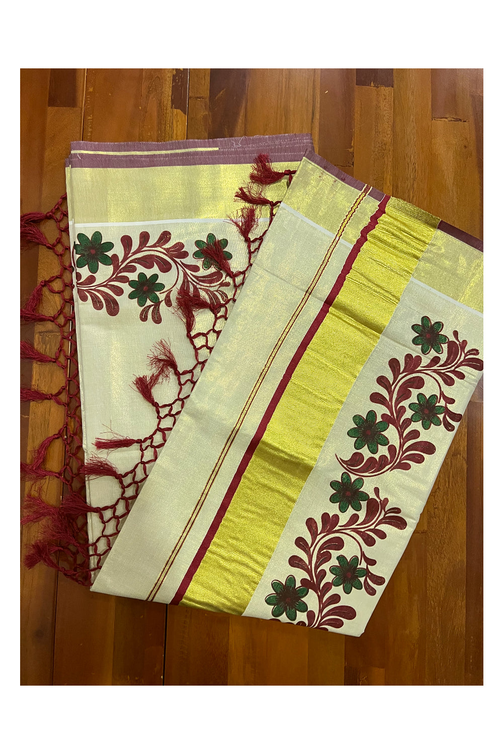 Kerala Tissue Kasavu Saree with Maroon Dark Green Mural Floral Design and Tassels on Pallu