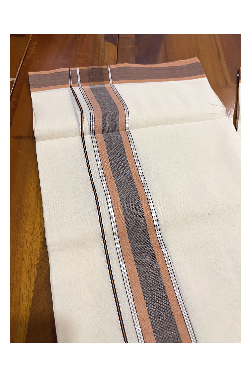 Southloom Premium Unakkupaavu Handloom Mundu with Silver Kasavu and Orange Border (South Indian Dhoti)