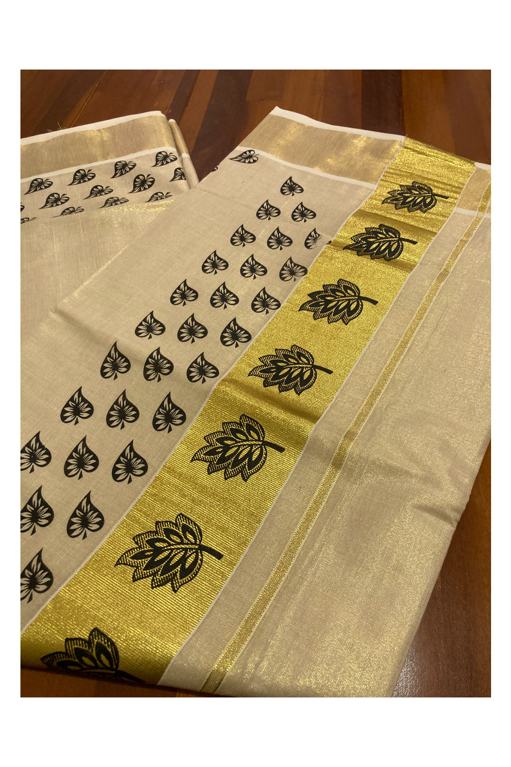 Kerala Tissue Kasavu Saree with Black Leaf Block Prints