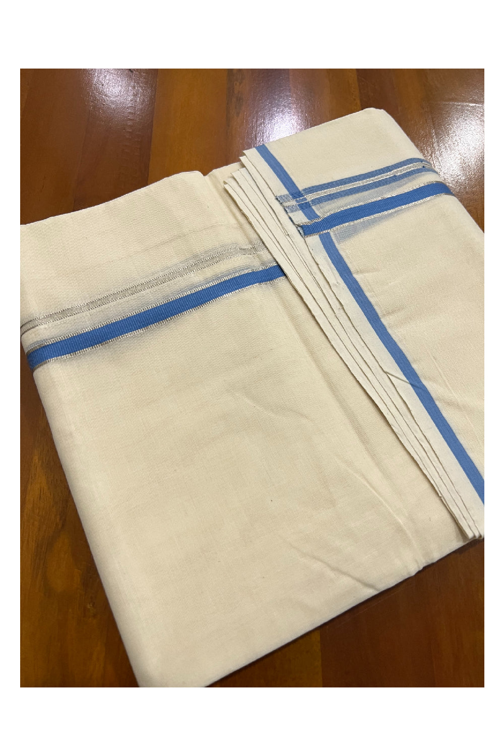 Off White Cotton Mundu with Light Blue and Silver Kasavu Puliyilakkara Border (South Indian Dhoti)