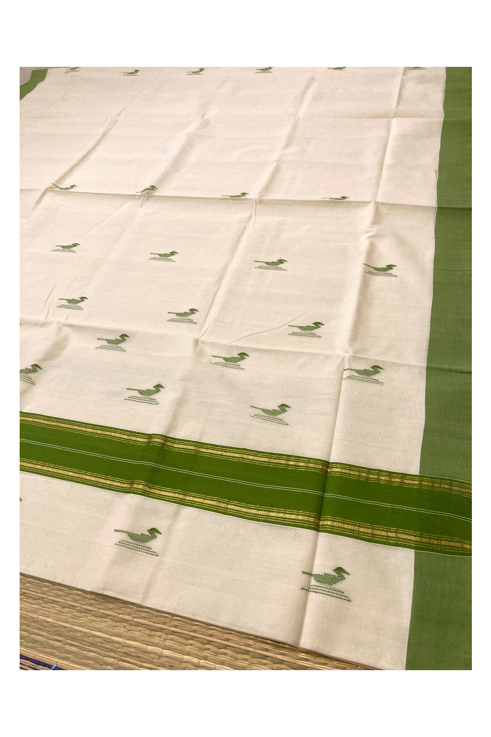 Southloom Premium Unakkupaavu Handloom Kerala Saree with Green and Pure Kasavu Border and Butta Works on Body