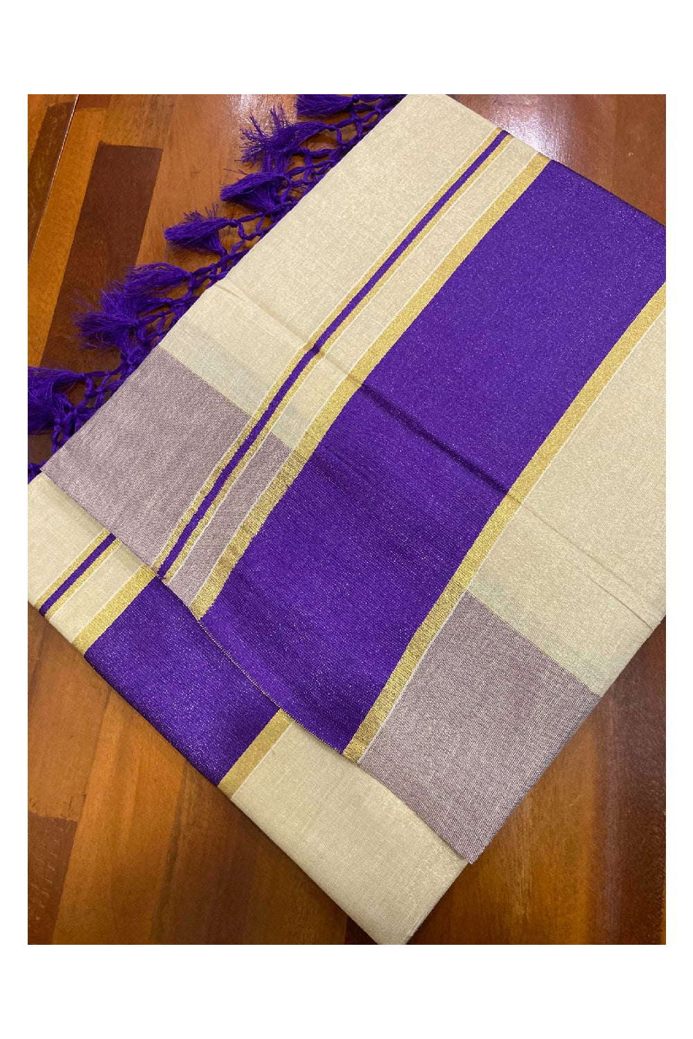 Kerala Kasavu Tissue Saree with Violet Kara and Border with Tassels