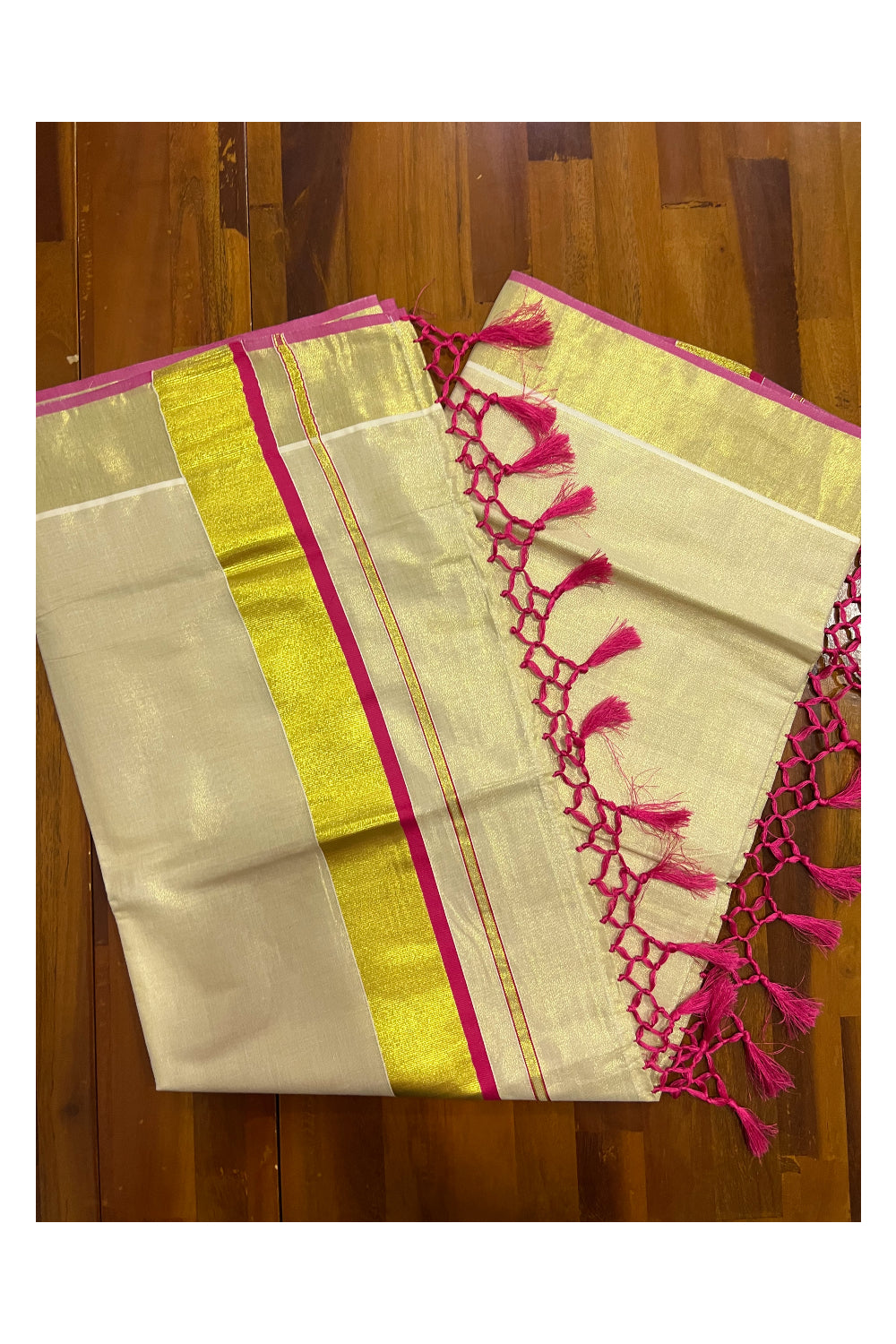 Kerala Kasavu Tissue Saree with Dark Pink Narrow Border and Tassels