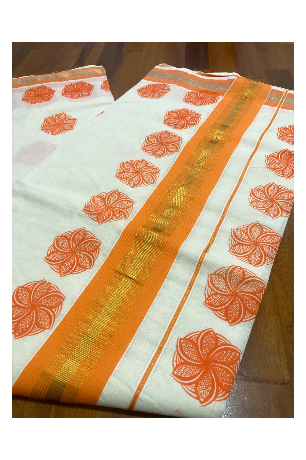 Pure Cotton Kerala Saree with Orange. Floral Block Printed Design and Kasavu Border