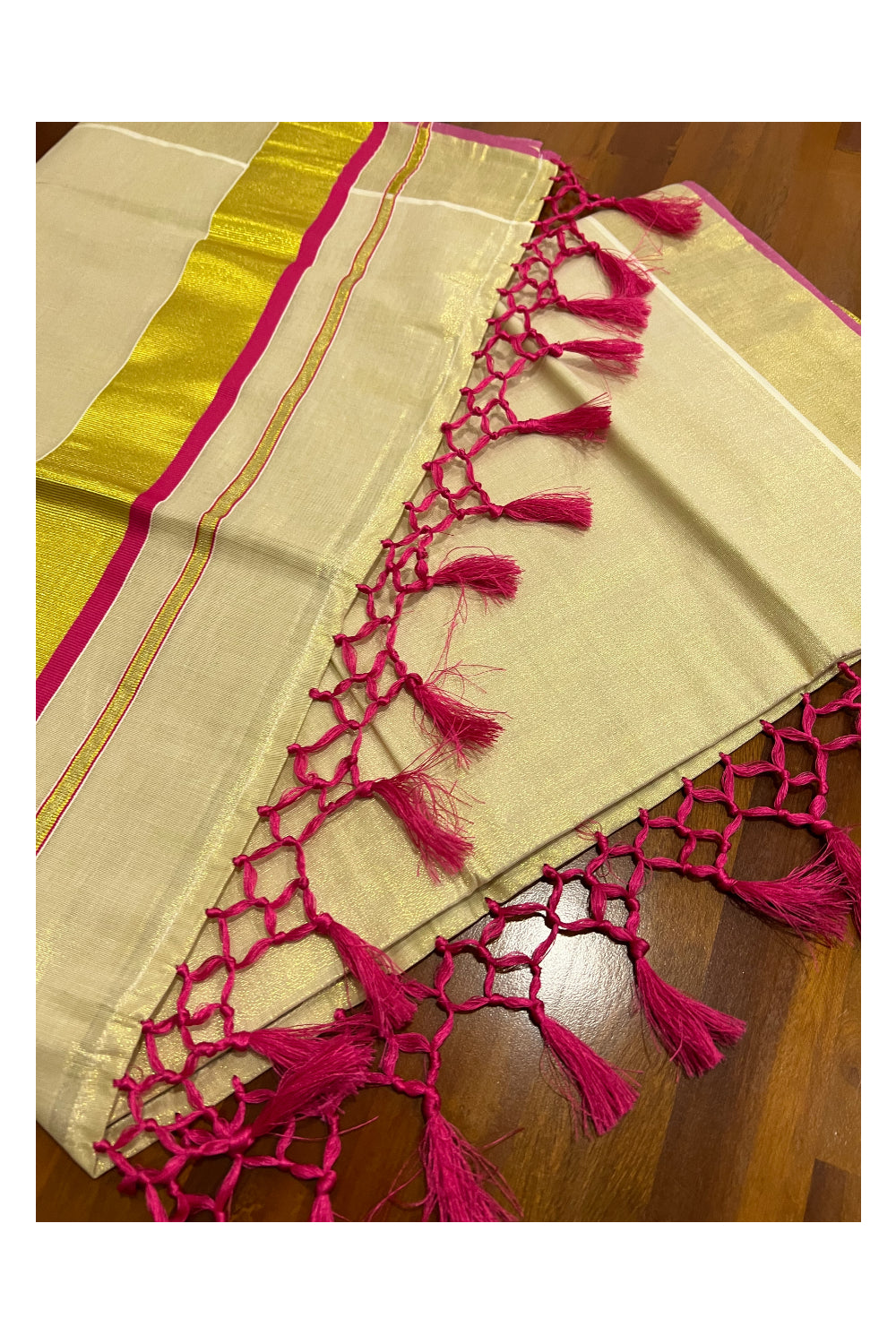 Kerala Kasavu Tissue Saree with Dark Pink Narrow Border and Tassels