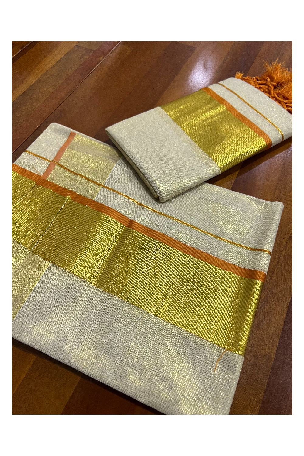 Kerala Tissue Kasavu Set Mundu (Mundum Neriyathum) with Kasavu and Orange Border and Tassels Work