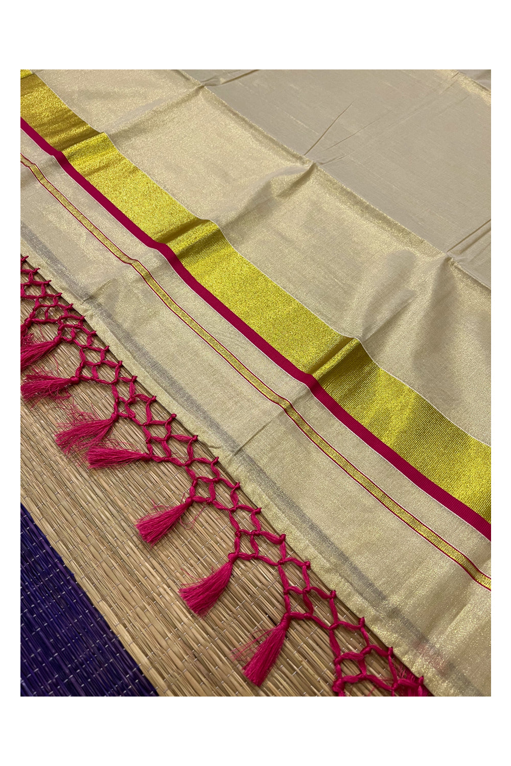 Kerala Kasavu Tissue Saree with Dark Pink Narrow Border and Tassels