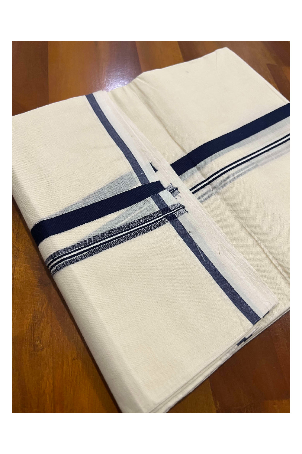 Off White Cotton Mundu with Navy Blue Puliyilakkara Border (South Indian Dhoti)