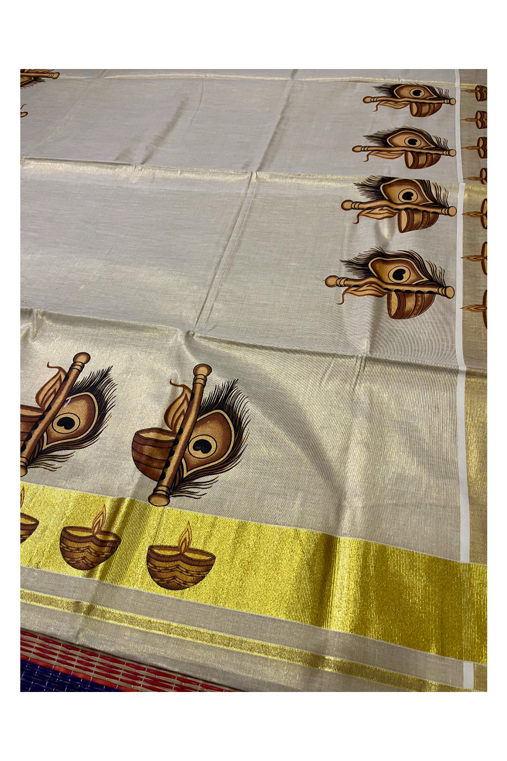 Kerala Tissue Kasavu Saree With Diya and Feather Mural Design and Printed Border