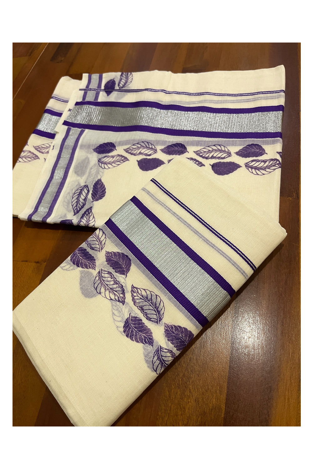 Pure Cotton Single Set Mundu (Mundum Neriyathum ) with Silver Kasavu and Violet Leaf Block Prints