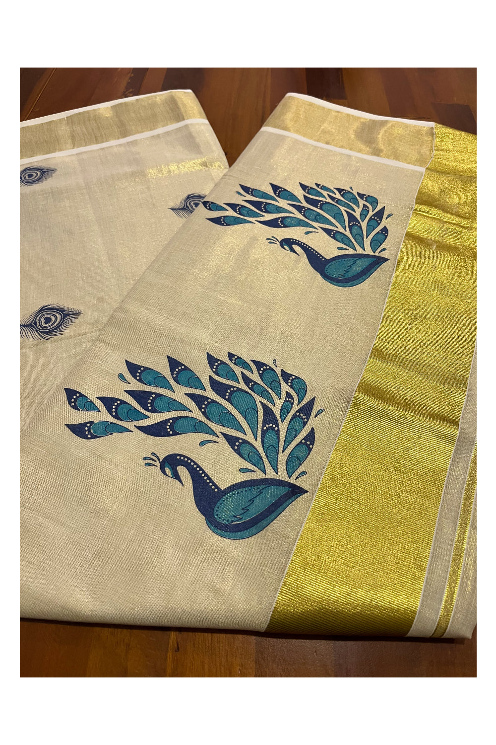 Kerala Tissue Kasavu Saree With Blue Peacock Mural Design