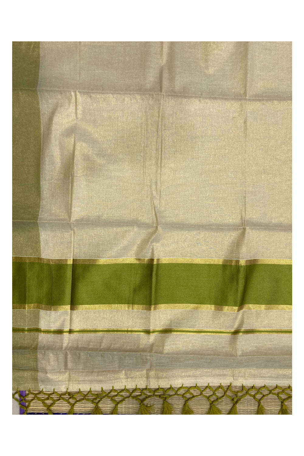 Kerala Kasavu Tissue Saree with Light Green Kara and Border
