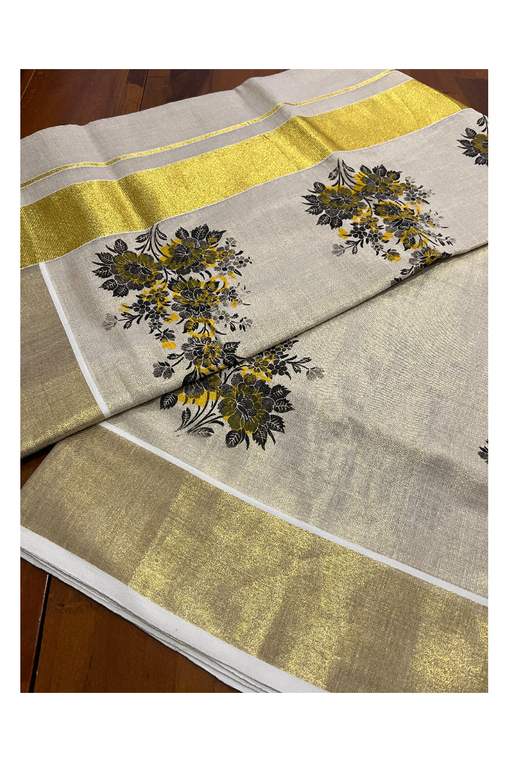 Kerala Tissue Kasavu Saree with Black Floral Block Printed Design