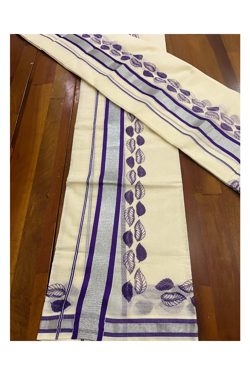 Pure Cotton Single Set Mundu (Mundum Neriyathum ) with Silver Kasavu and Violet Leaf Block Prints