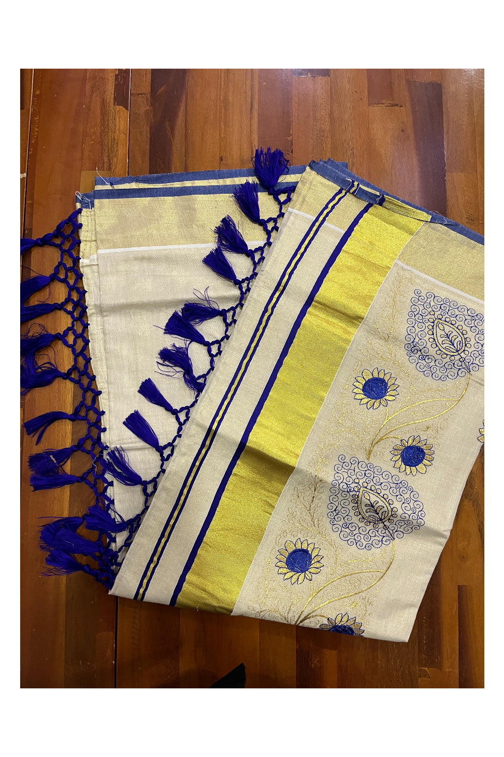 Kerala Tissue Kasavu Heavy Work Saree with Golden and Blue Floral Embroidery Design