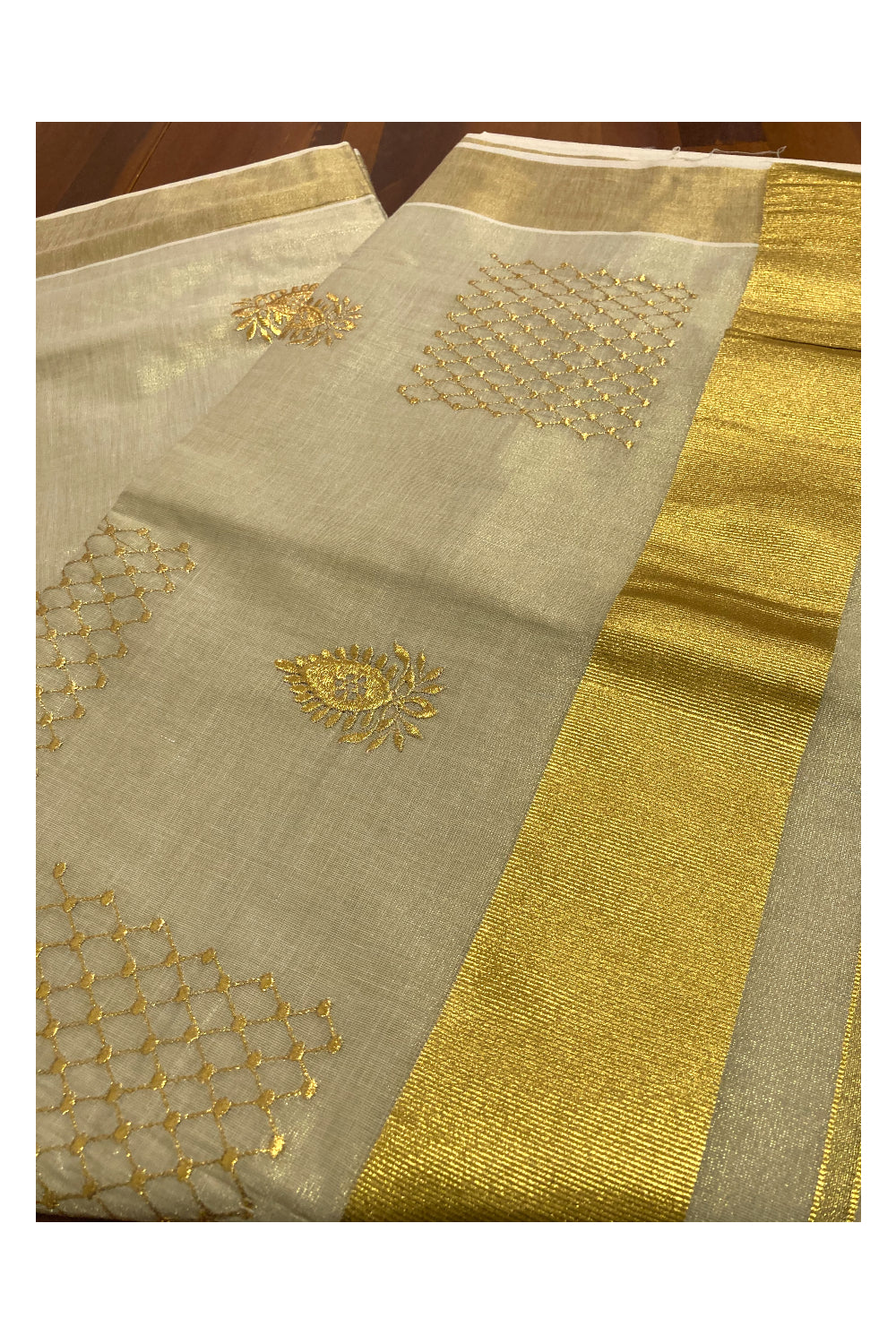 Kerala Tissue Kasavu Saree with Floral Golden Embroidery Works